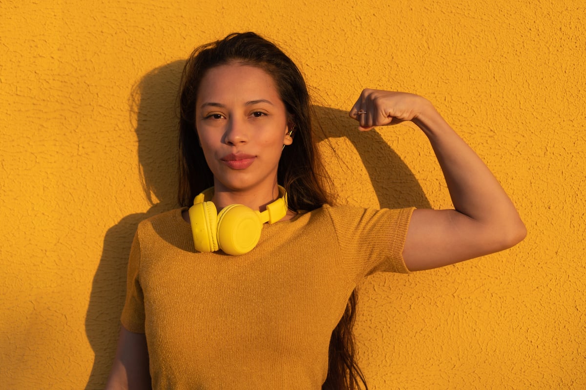 A happy and self-confident  woman demonstrates empower