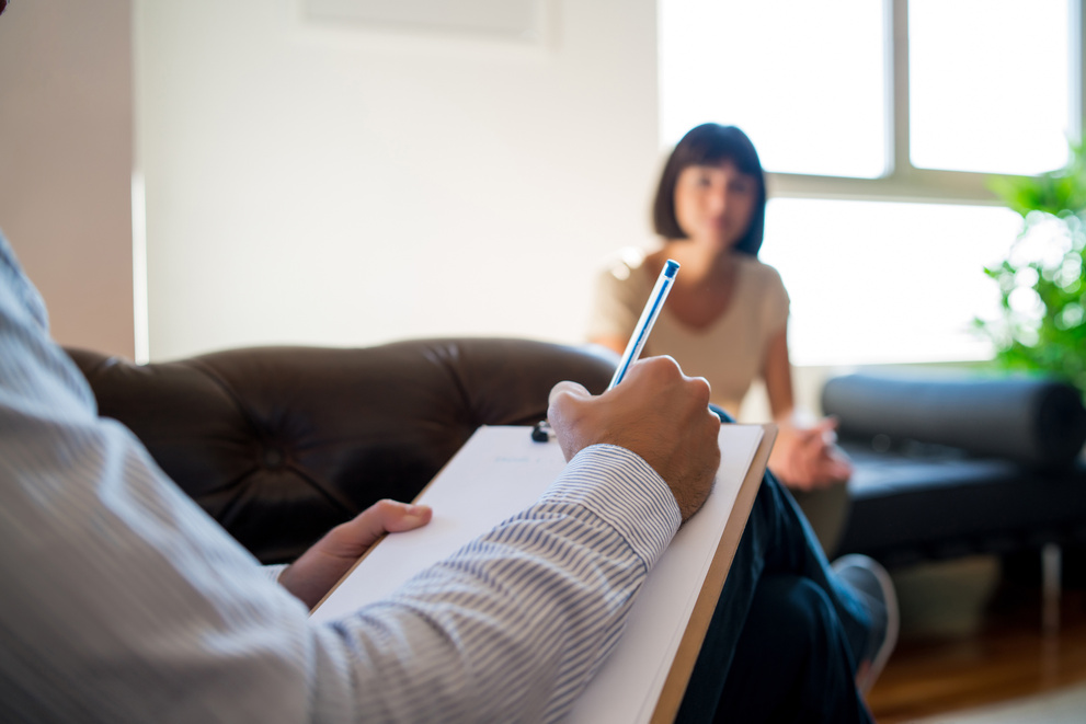 Psychologist Taking Notes during Therapy Session.